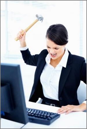 capture-frustrated-woman-at-computer-with-hammer